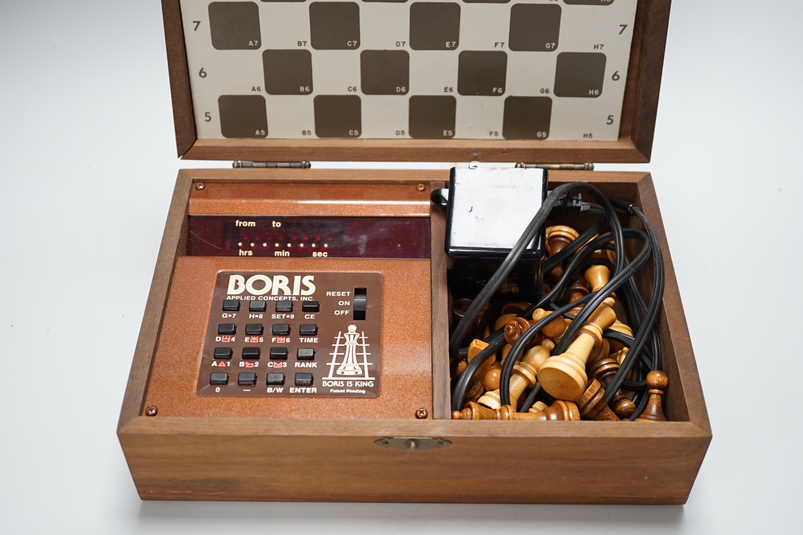 A 1970's Boris electronic chess set by Applied Concepts Inc., in a walnut case, 25.5cm x 17cm